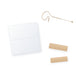 Adhesive remover wipe with mic tape strips and a beige earset microphone (mic and tape not included)